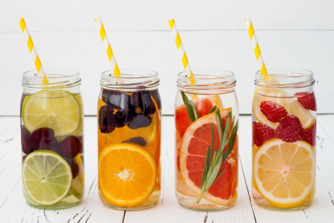 Detox fruit infused flavored water. Refreshing summer homemade cocktail