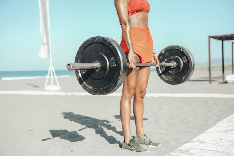 Beach Workout Woman Lifting Weights